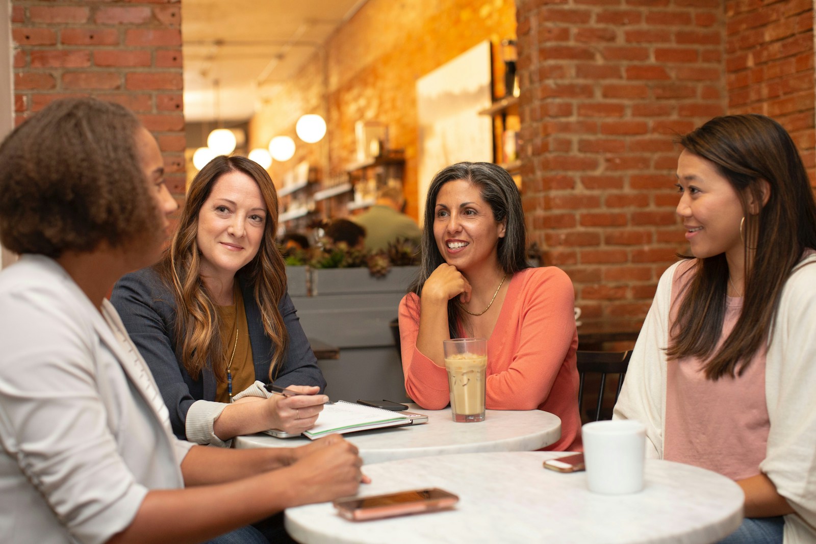 Women exchanging ideas around a meeting table