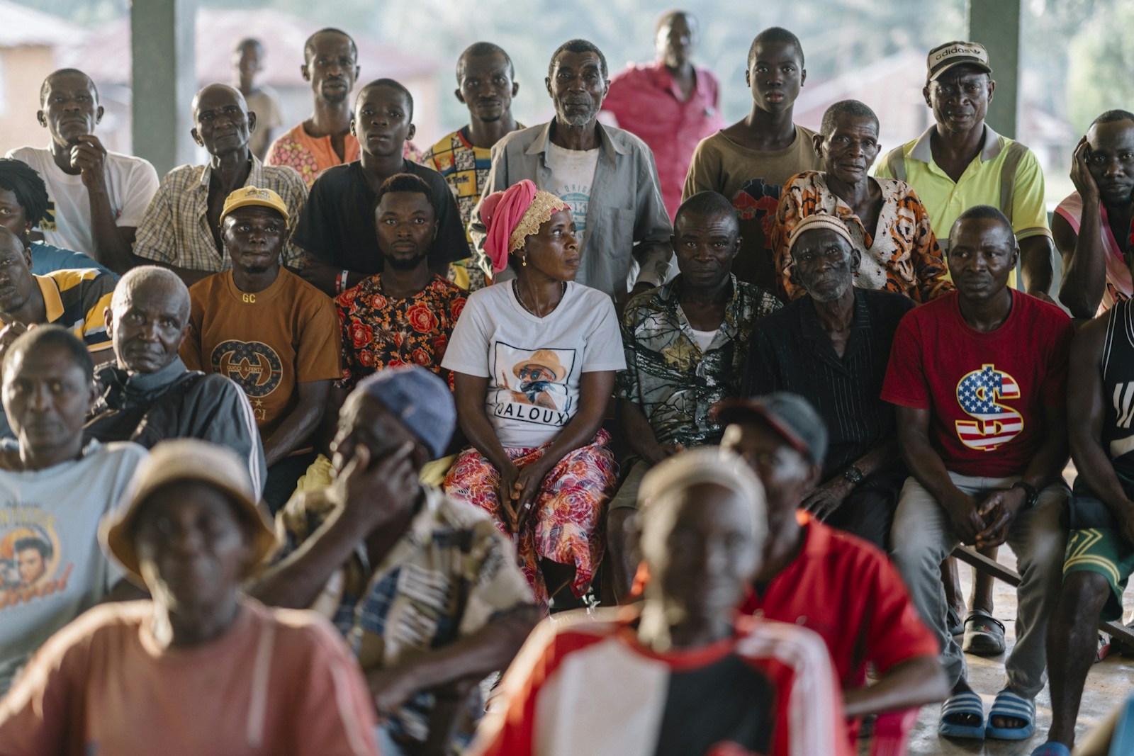 Women listening closely during a community gathering